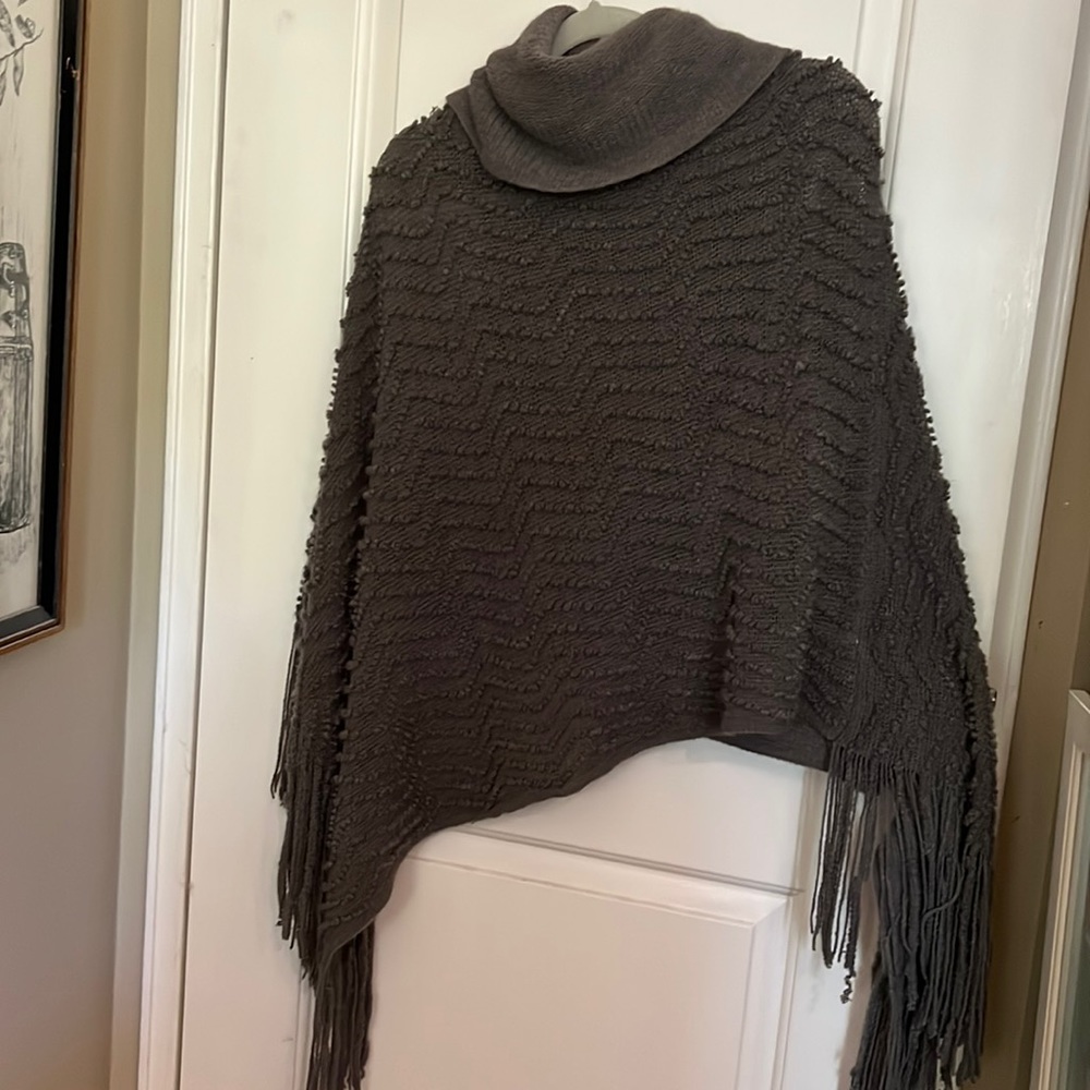 Sweater poncho with soft hoodie.